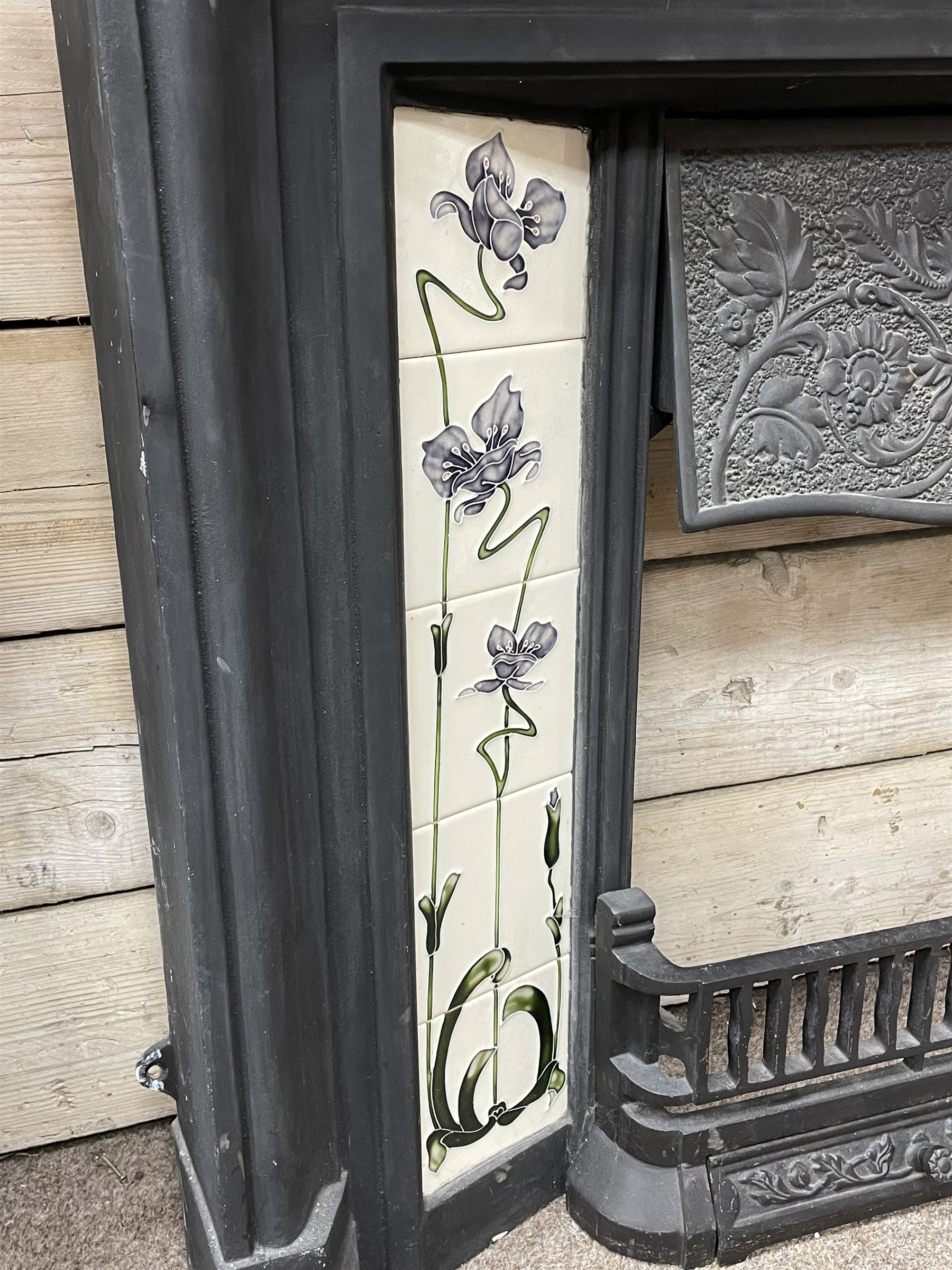 The Gallery Collection Fireplaces - 'Edwardian' cast iron fireplace, the hood decorated with interlacing floral design, with Art Nouveau inspired upright tiles
