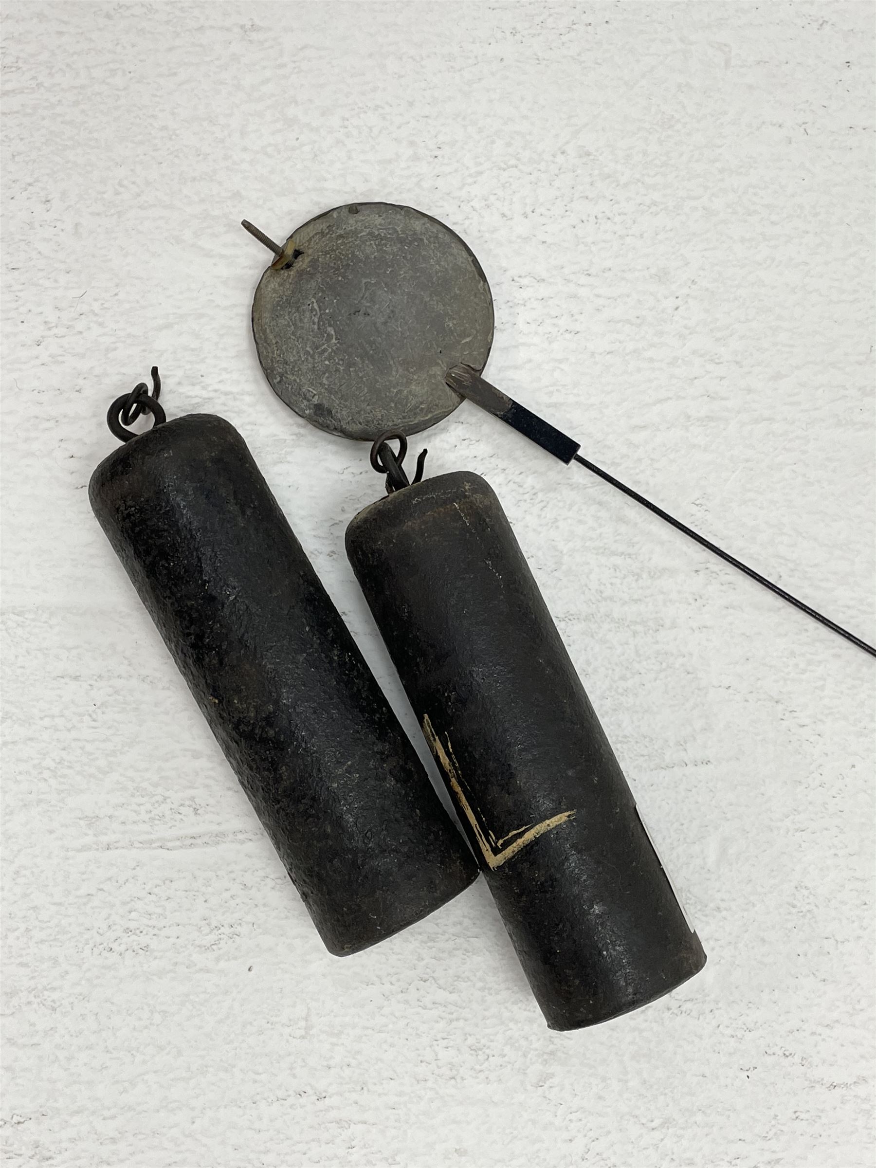 19th century carved oak longcase clock, projecting cornice over guilloche carved frieze, square brass dial with silvered Roman chapter ring and calendar aperture, decorated with ornate mask cast spandrels, the trunk door and base carved with potted plant, twin train driven eight day movement striking on bell