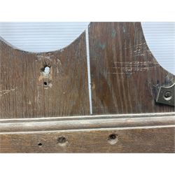 George III oak spoon rack and candle box, the rectangular backplate with shaped  pediment and two six aperture spoon racks, above a candlebox with hinged cover, with various brass spoons and a pair of brass candle snuffers, H56.5cm, W35cm, D14cm 