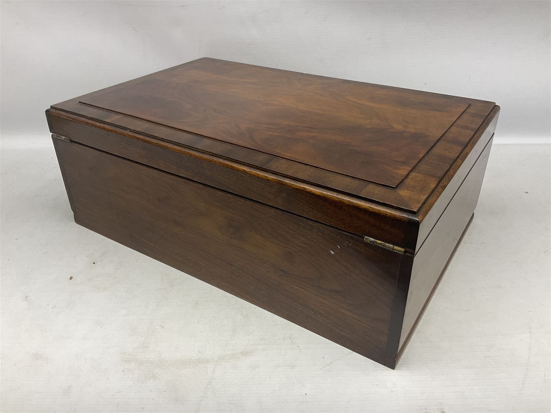 Elkington & Co part canteen of silver plated and stainless steel cutlery, to include simulated ivory handled examples, housed in oak and mahogany case, lock plate stamped 'Acme, British Made', W49cm D31cm H18cm