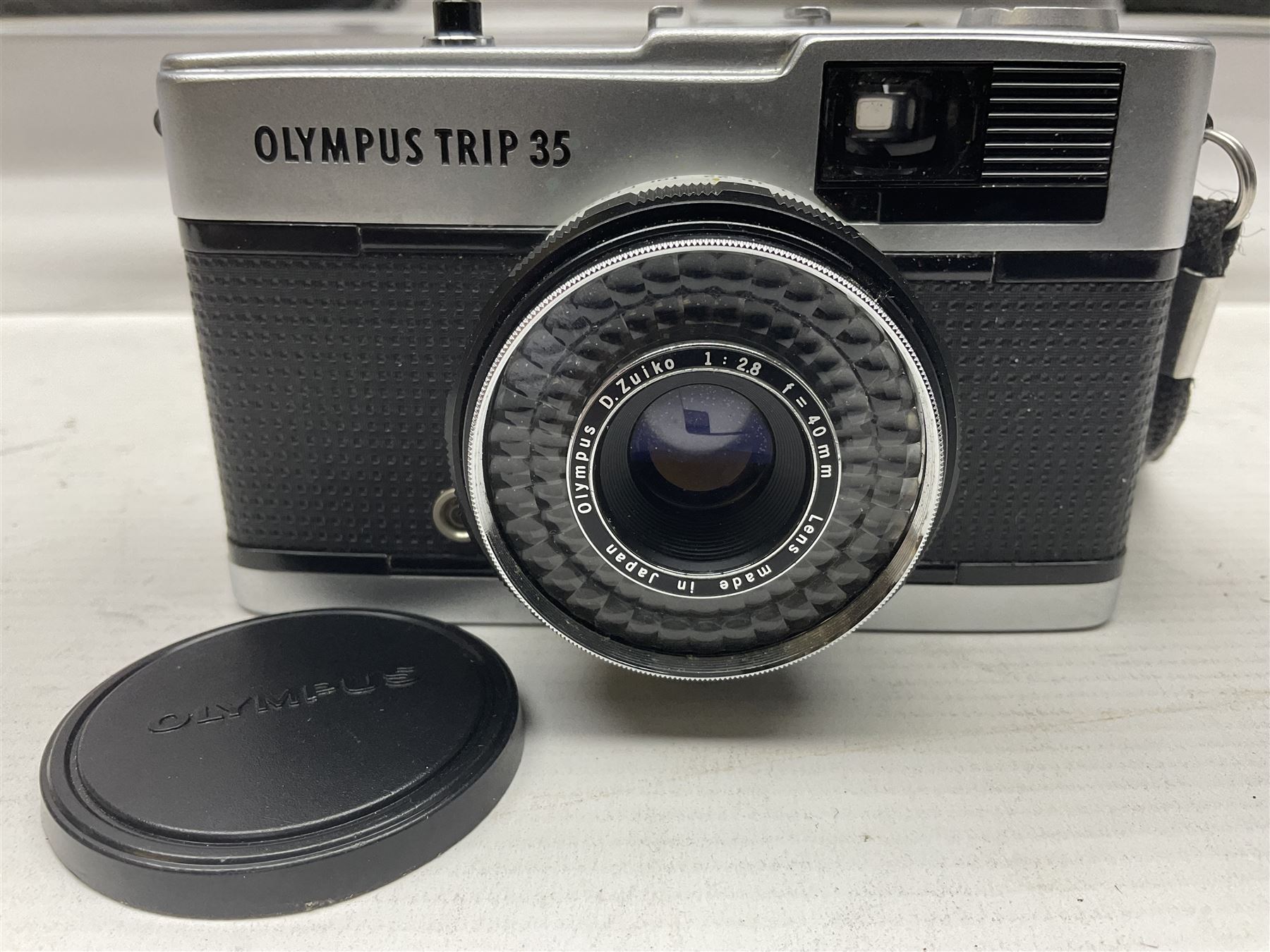 Four Olympus camera bodies, including Olympus OM10, serial no 20744269, with 'Olympus OM-System Zuiko Auto-S 50mm 1:1.8' lens serial no 3633644, Olympus OM-2 camera body serial no 460280 with 'Olympus OM-System G.Zuiko Auto-s 1:1.4 f=50mm' lens, serial no 729750, etc 