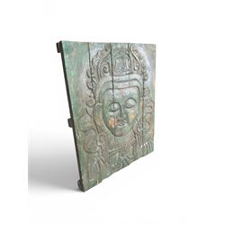 Pair of South East Asian carved wooden panels, depicting Buddha or Deity faces