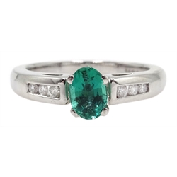  18ct white gold oval emerald ring, with round brilliant cut diamond shoulders, emerald approx 1 carat  