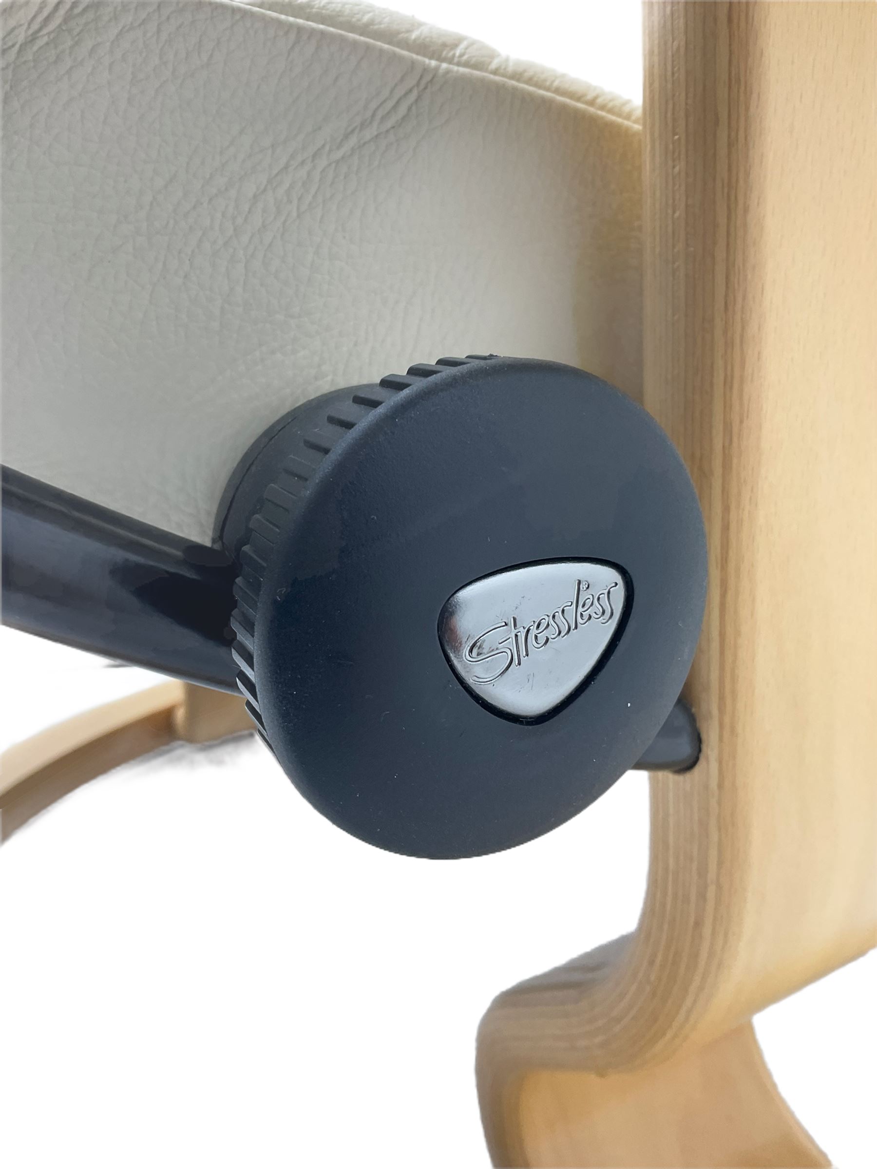 Ekornes - Stressless armchair upholstered in cream leather with matching footstool 