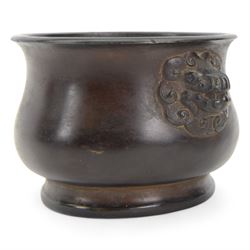 Chinese bronze censer, of circular bellied form with temple lion mask handles, upon a circular foot, with apocryphal six character Xuande mark within a border of two dragons chasing a pearl, H7.5cm D10/5cm
