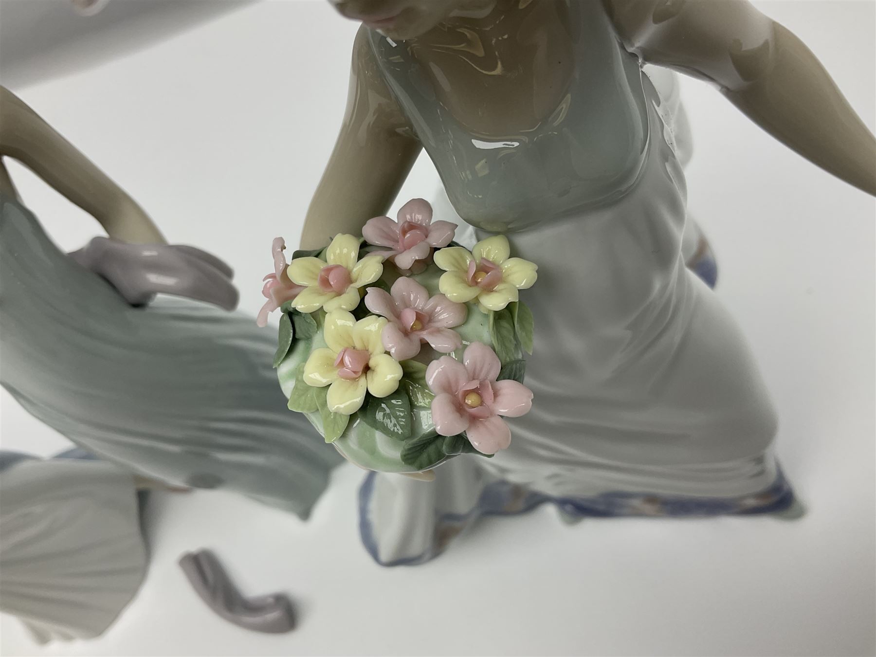 Three Lladro figures of ladies comprising 'The Flirt' model no 5789, 'Ingenue' model no 5487 and 'Carefree' model no 5790, all with boxes