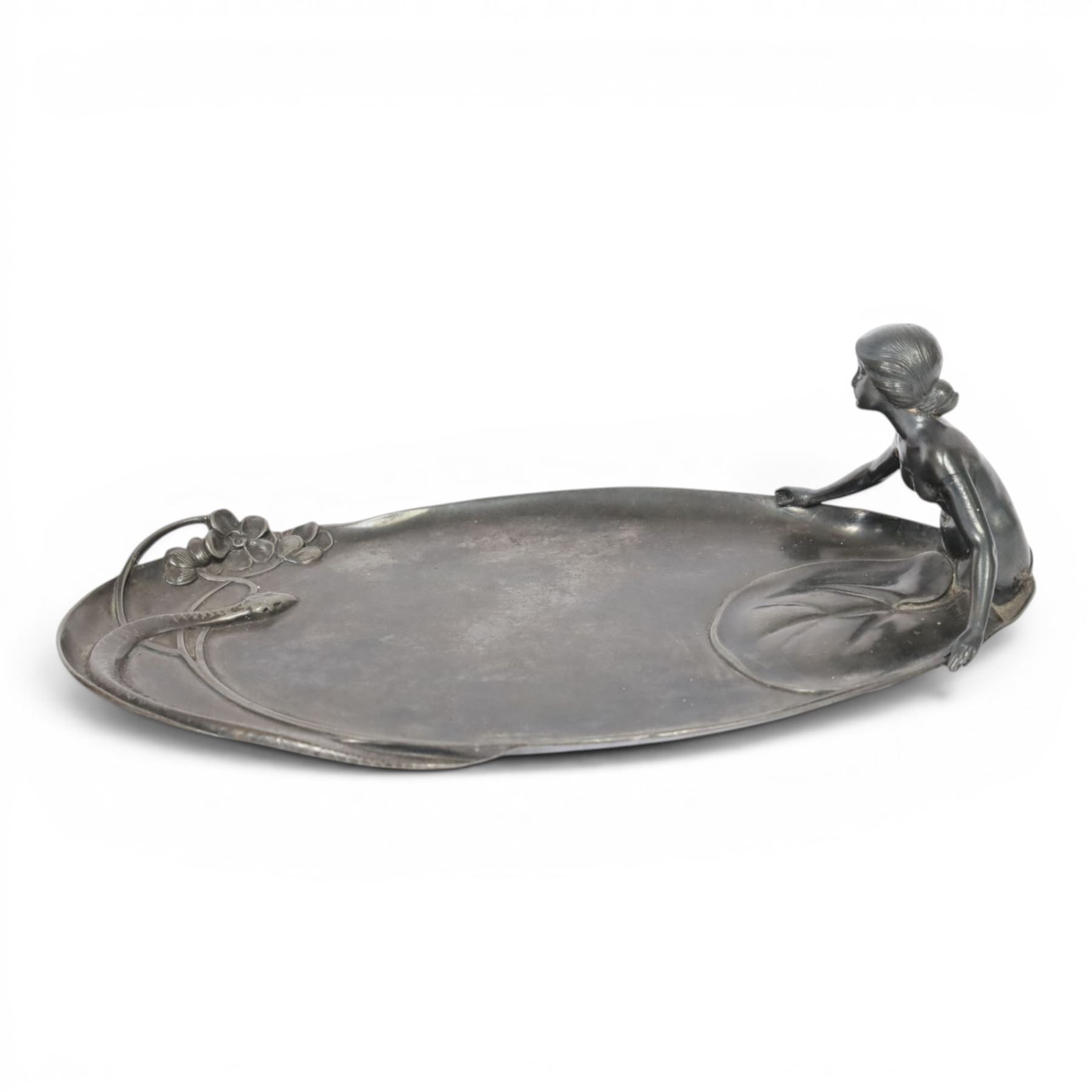 WMF Art Nouveau pewter tray, of oval from, with a female figure covered with a lily pad at one end, and snake with flowers and whiplash stems at other, signed and impressed marks beneath, H8cm, L25cm 