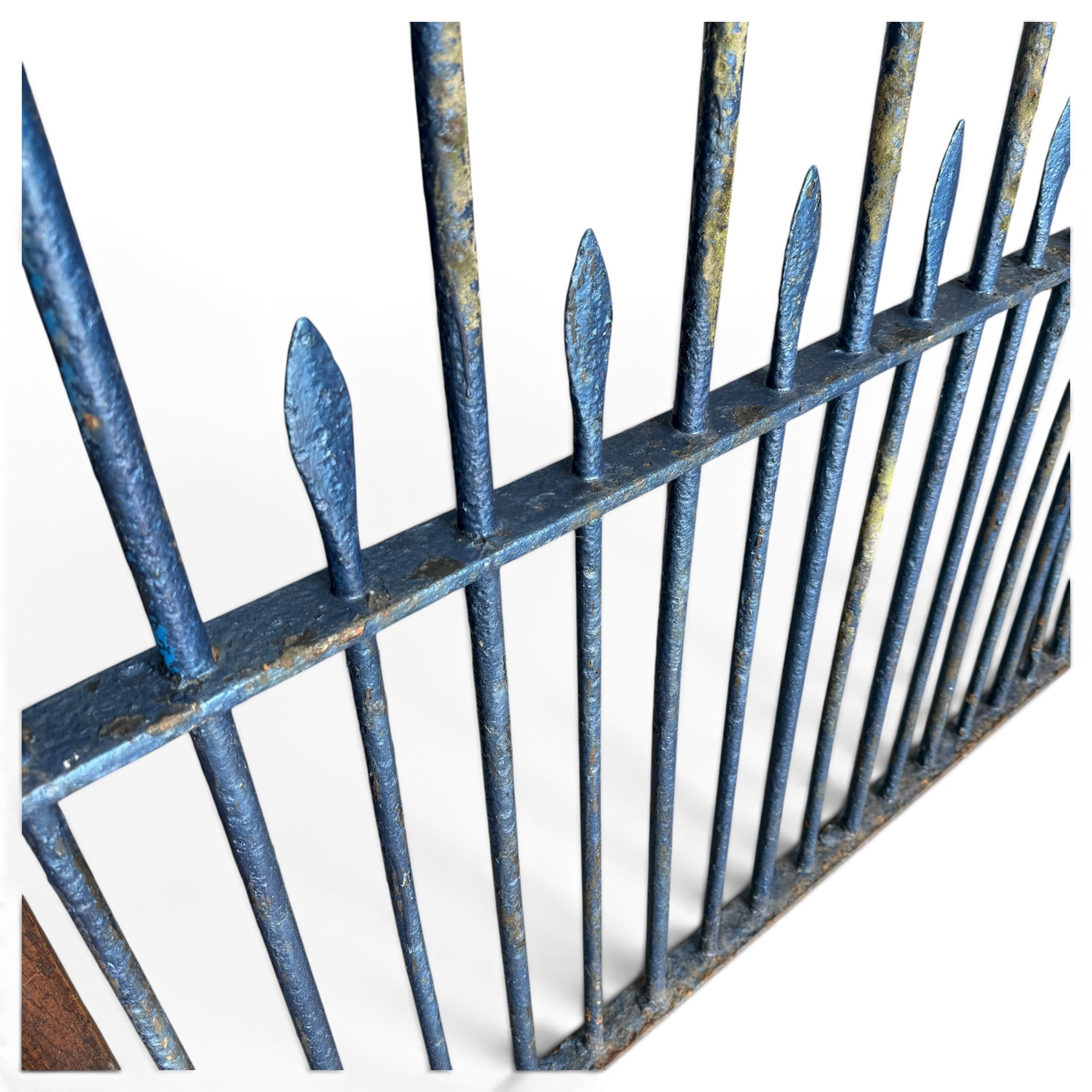 Two sections of painted iron garden or estate boundary railing, comprising a 19th century wrought iron section with graduated spearhead uprights, together with a later hoop-top section with ball-finial end posts, both in blue painted finish