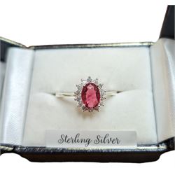 Silver cubic zirconia and pink/red stone cluster ring, stamped 925, boxed
