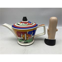 Novelty ashtray modelled as bald headed singer, the base entitled `By the light of the silvery moon...' together with a Sadler teapot of Clarice Cliff Farmhouse pattern style