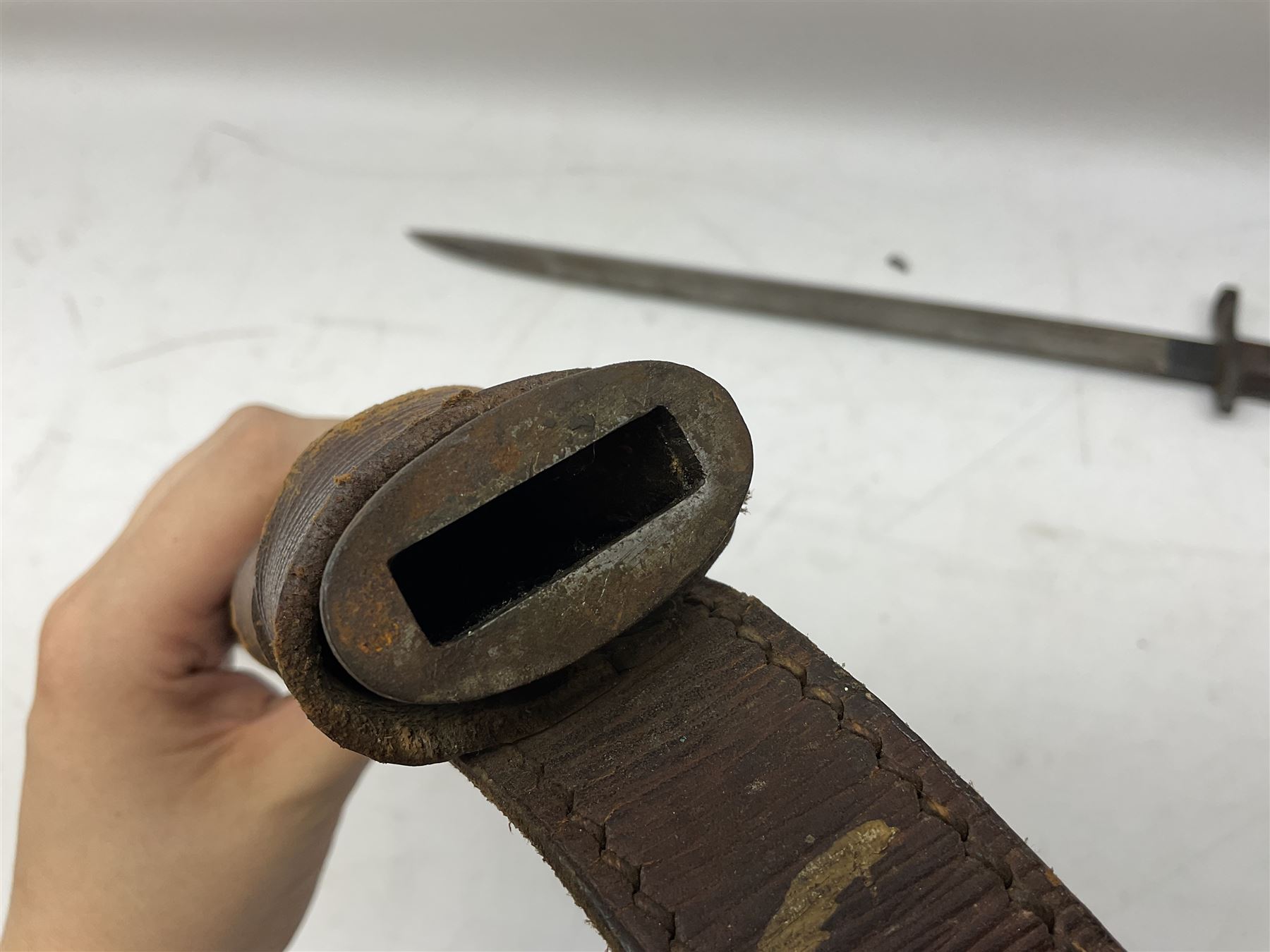 WW1 American Model 1917 Enfield bayonet by Remington with 43cm fullered steel blade; in leather scabbard with frog L59cm overall; and American M5A1 knife bayonet marked MILPAR COL to the cross-piece (no scabbard) (2)