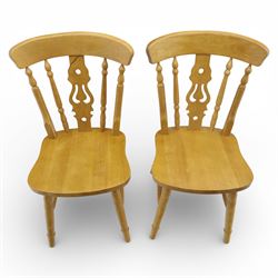 Solid oak dining table and set of seven pine farmhouse chairs including two carvers, rectangular top with tongue and groove style finish, supported a 'H' stretcher with square chamfered legs, pine farmhouse chairs with central splat and turned legs