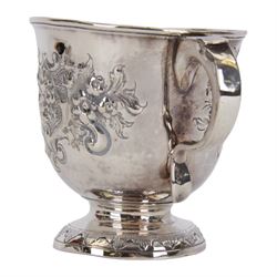 George I silver porringer, of typical form with flat capped twin curved handles,  the body with later presentation engraving surrounded by later embossed foliate decoration, upon a spreading circular foot, hallmarked Sarah Holaday, London 1723, H10.5cm