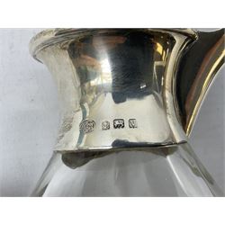 Silver mounted glass claret jug, the compressed bellied body with silver neck, hallmarked Alexander Clark & Co Ltd, Birmingham 1945