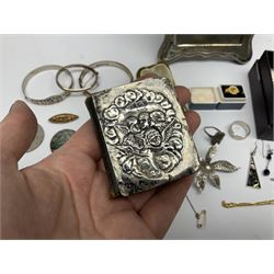 Silver mounted photograph frame, hallmarked Birmingham 1923, makers mark worn and indistinct, silver mounted miniature bible, the cover embossed with putti, hallmarked Birmingham 1905, two silver hallmarked bangles, silver and gold ring, and Victorian and later costume jewellery