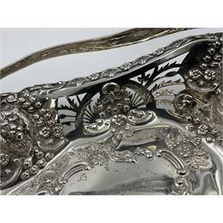 Edwardian silver swing handled basket, of navette form, with four repousse lion masks to each corner and with pierced and embossed floral, scroll and shell decoration to sides, base and handle, hallmarked Charles Horner, Birmingham 1906, height including handle H20cm