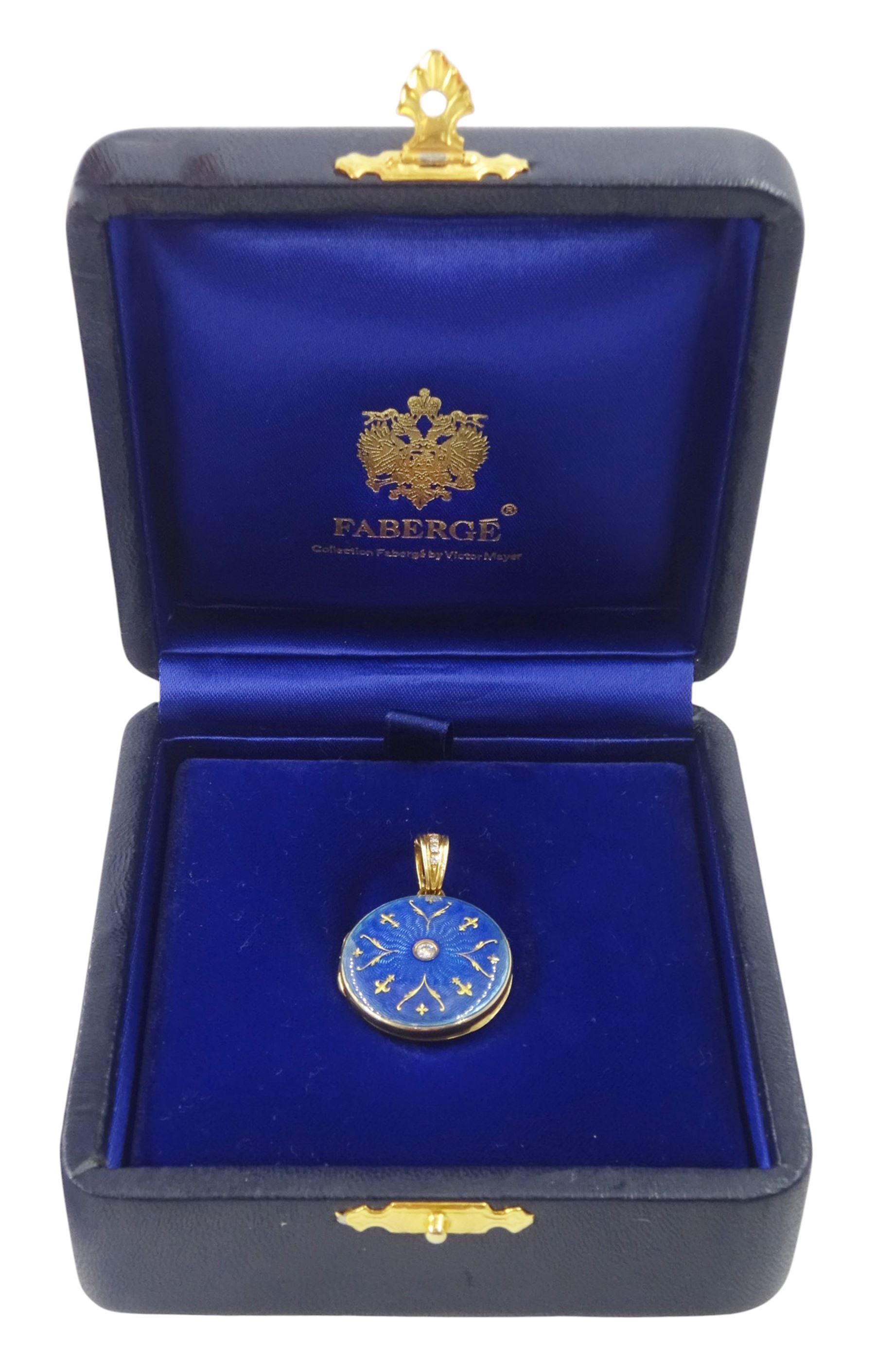 Victor Mayer for Fabergé 18ct gold pendant, guilloche blue enamel circular locket set with a single round brilliant, with a diamond set bail, stamped 750, boxed with certificate