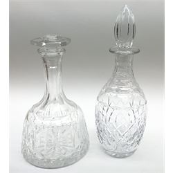 Large modern clear glass decanter or claret jug, of bulbous form with curved handle to the tapering neck, stopper with ball finial, and etched decorated depicting a crowned coat of arms to one side, and flowering basket to the other, H37cm, together with two Stuart Crystal bowls, and a group of five glass decanters of various form. 