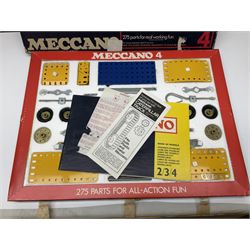 Meccano - Outfits 2, 3 & 4 with blue and yellow parts; look to be virtually complete with most apertures filled; together with a partially stocked Meccano Elekrikit; all boxed with instruction manuals (4)