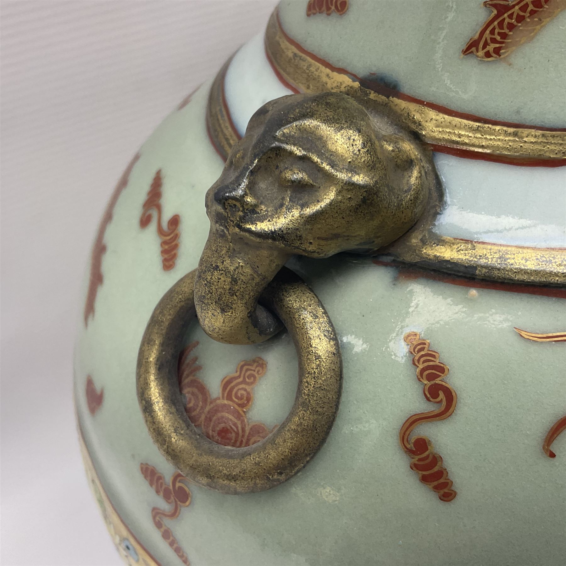 Pair of early 20th century Chinese vases decorated with dragons chasing a flaming pearl, with a gilt border of butterflies and floral sprigs, with Elephant head handles, H44cm 