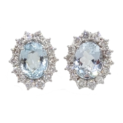  Pair of 18ct white gold oval aquamarine and round brilliant cut diamond cluster stud earrings, stamped 750, aquamarine total weight approx 5.00 carat, diamond total weight 1.5 carat  