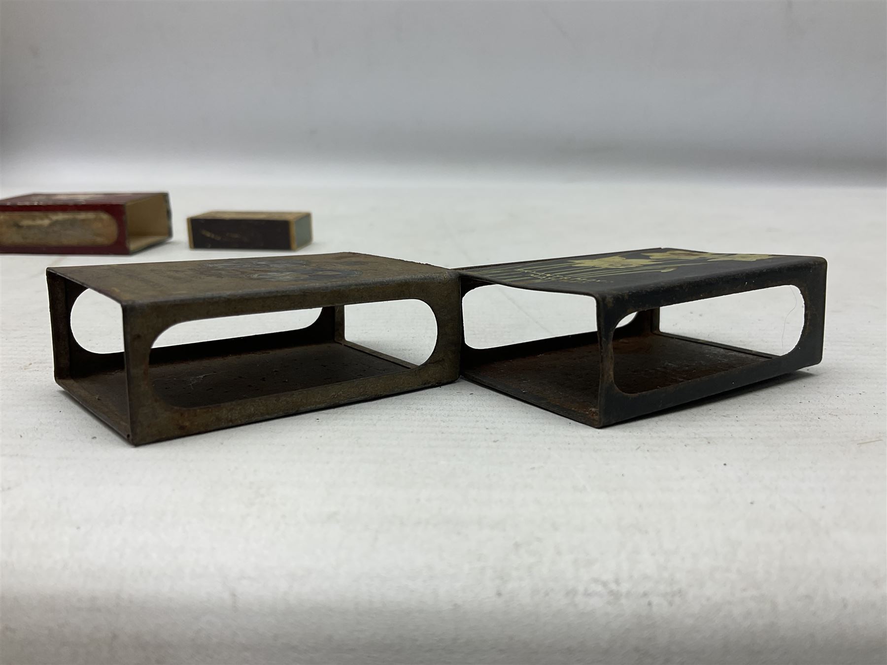 Victorian leather cigar protector with metal match striking plate on the end and internal spring to hold the cigars in place; expands for differing lengths of cigar, minimum L12.5cm; another similar leather cigar case marked Middlemore's Patent with attached vesta case and striker; three Bryant & Mays tin-late matchbox holders including 1935 Jubilee; and small box of matches (6)