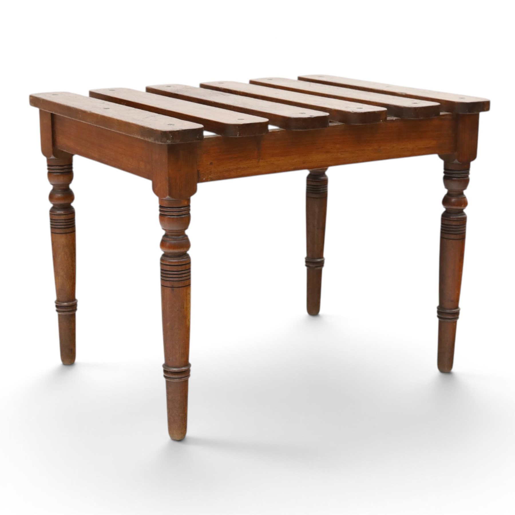 Victorian mahogany luggage stand, slatted top of rectangular form over plain frieze rails raised on ring turned supports