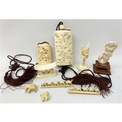A small group of early 20th century ivory and bone, to include two carved inros, two small carvings, one modelled as a mermaid, a small rest/stand, two brooches carved with camels, etc., largest inro H8.5cm.   