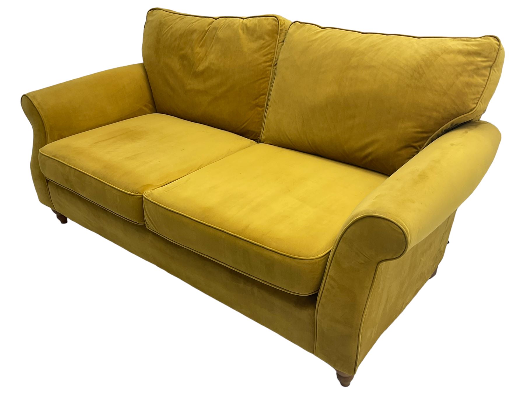 Next Furniture - traditional shaped three-seat sofa, upholstered in mustard velvet, rolled arms with pipping, on turned front feet