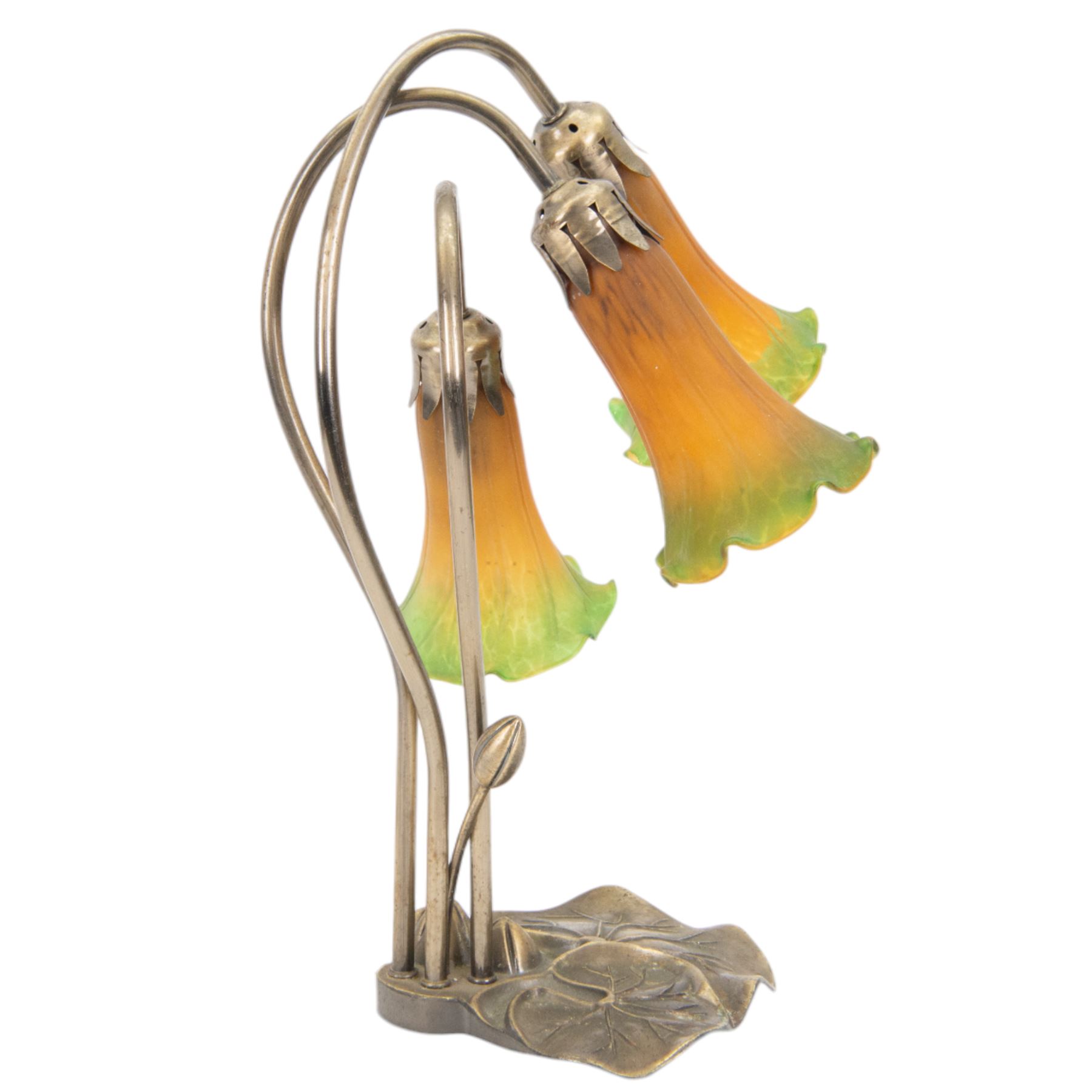 Art Nouveau Tiffany style table lamp, the bronzed base modelled as lily pads leading to tendrils and three branches supporting green and yellow glass lily flower shades, H42cm