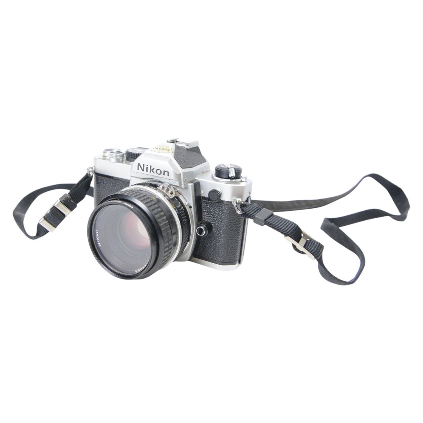 Nikon FM SLR camera body serial no. 2253063, together with a Nikkor 50mm 1:1.8 lens serial no. 2154684, Nikon Series E 75-150mm 1:3.5 zoom lens serial no. 3060109 and an Ohnar zoom slide duplicator