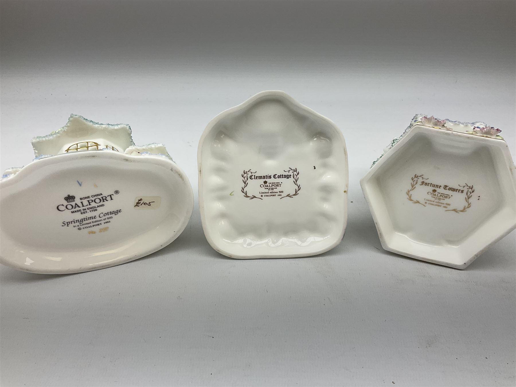 Twelve Coalport bone china pastille burner cottages, to include Fortune Towers, Summer Palace, The Vinery, Springtime Cottage, Dream Villa, Half Moon House, etc, all with original boxes and some with certificates 