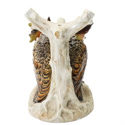 Continental figural group of two owls, possibly by Ernst Bohne & Söhne, modelled in a naturalistic setting, H25cm; together with a model delft charger (2)