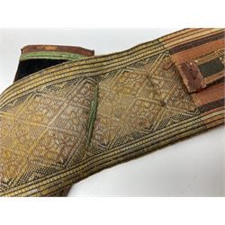 Late 19th century Yemeni Tuza jambiya as worn by religious elite, the 20.5cm curving blade with raised medial ridge, the horn hilt with pique style studwork, in a leather wrapped wooden scabbard with pierced metal mount and leather belt applied with embroidered 'gold' and 'silver' thread work panel; dagger L36cm overall, belt L84cm