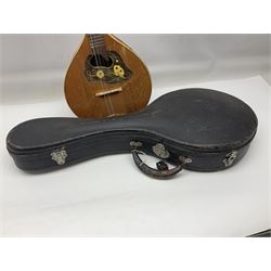 Italian eight-string mandolin with maple back and ribs and spruce top with inlaid floral marquetry panel within a fragmented mother-of-pearl border L61cm; cased; and a (damaged) German 'Michigan' mandolin for spares or repair (2)