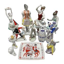 Group of ten Hollohaza of Hungary figures, to include Pierrot clown figure group, Aladdin on the Flying Carpet, girl in traditional dress seated with chillies, ballerina, etc, together with a rectangular dish decorated in black and red with a gentleman upon horseback, all with printed marks beneath, tallest H30cm (11)