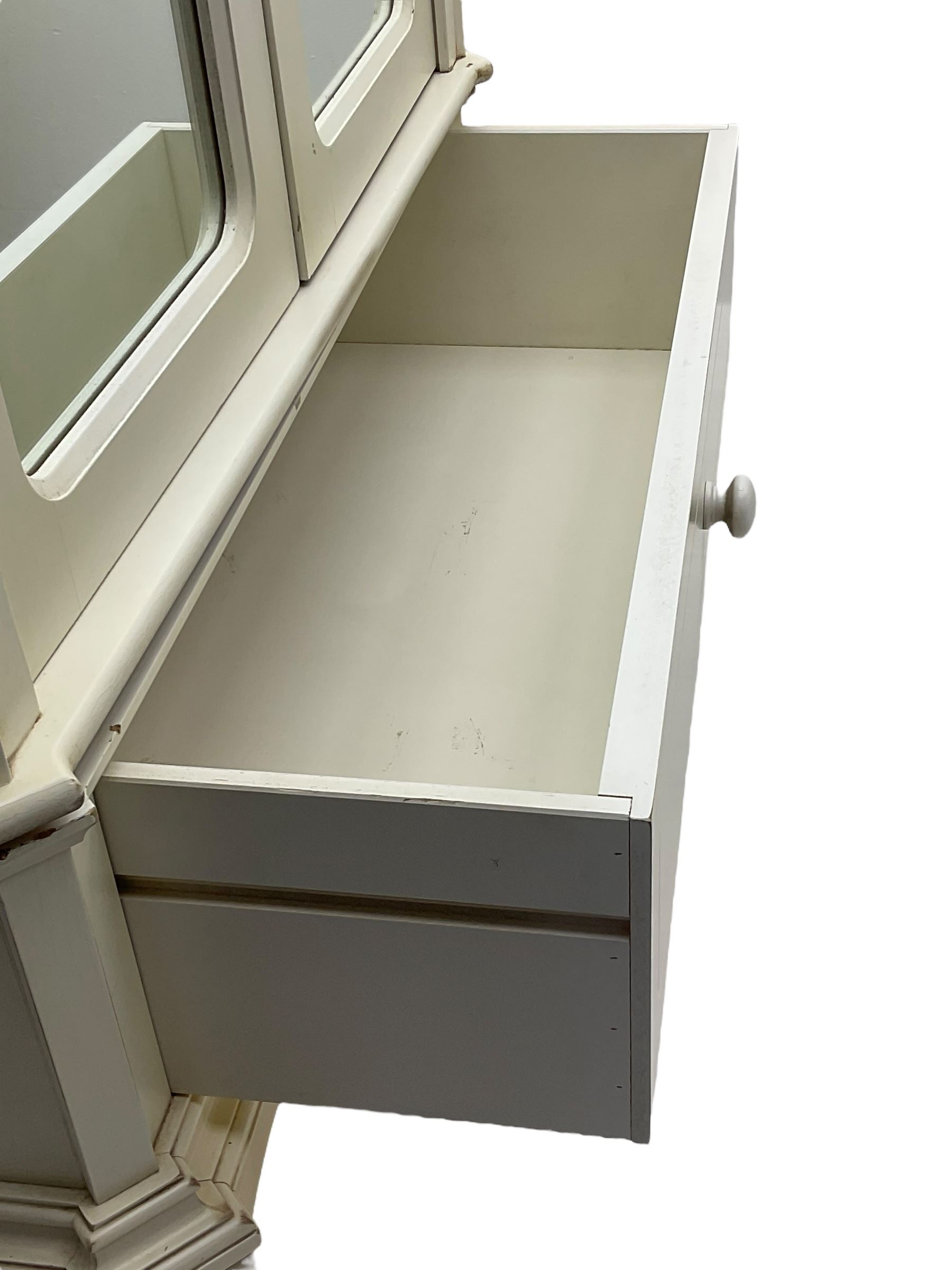 French design cream painted armoire wardrobe, shaped top with shell and flower head pediment, enclosed by two mirror glazed doors, the base fitted with single drawer