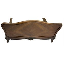 Early 20th century French walnut 4' 6'' double bedstead, the headboard with moulded frame carved with C-scroll shell decorated with foliage, on foliage carved cabriole feet with scrolled terminals