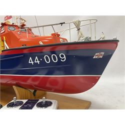 Two remote controlled kit-built plastic model boats - RNLB Sheerness Lifeboat Helen Turnbull L92cm and 'Conserver' Grangemouth L76cm; each on wooden stand; together with three remote control units