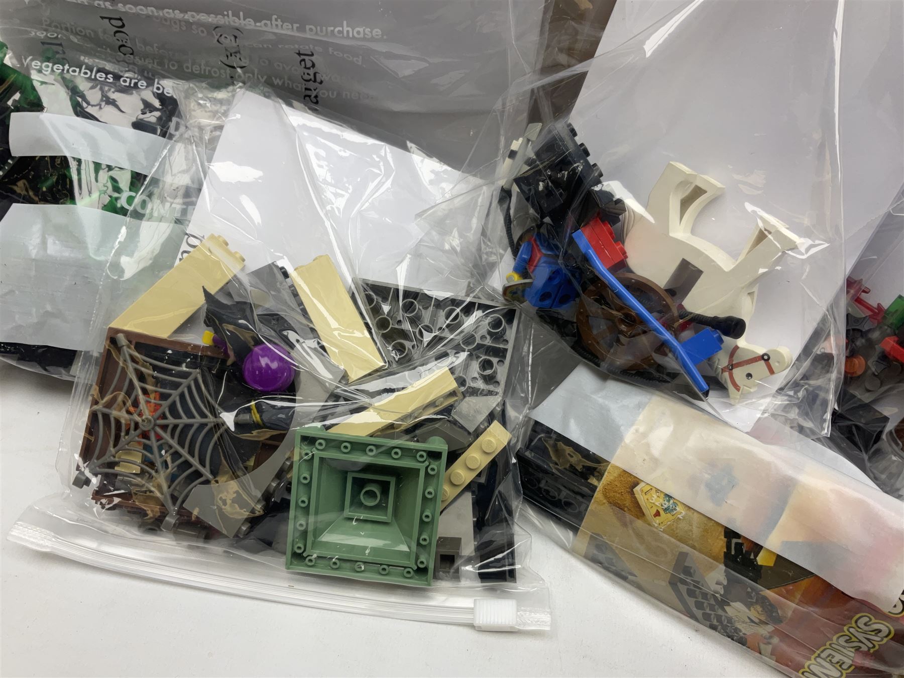 Lego - ten kits comprising Harry Potter Magic Mirror 4702; Extreme Team Rocket Car/Plane 6580; two Adventure Egypt Cars 5918; Adventure Egypt Bi-Plane 5928; Adventure Egypt Tombs and Car 5919 in golden Tutankamun box; Castle Knight with Horse & Cart 6016; Castle Witch & Fireplace 2872; Castle Robin Hood Hideout 6054; and Pirate Ship 6285; together with over 3.5kg of loose animals, characters and bricks etc; all unboxed