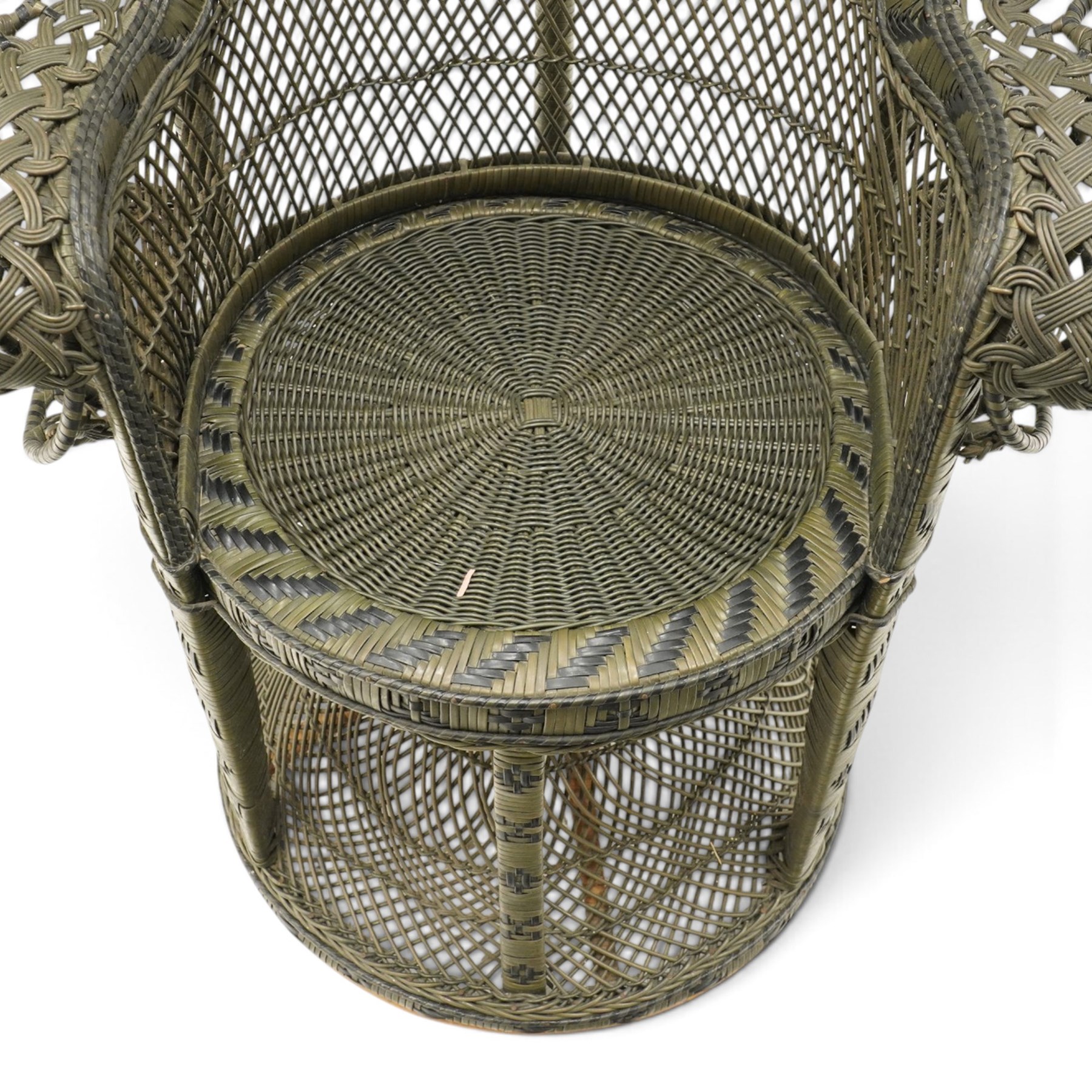 Mid-20th century wicker and rattan Peacock chair in unusual tones of dark olive and black, high fan back with a pieced and woven frame terminating to scrolled arms, with loose seat cushion