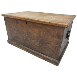 Small 19th century stained elm blanket chest, rectangular hinged top, with twin metal carrying handles, on skirted base