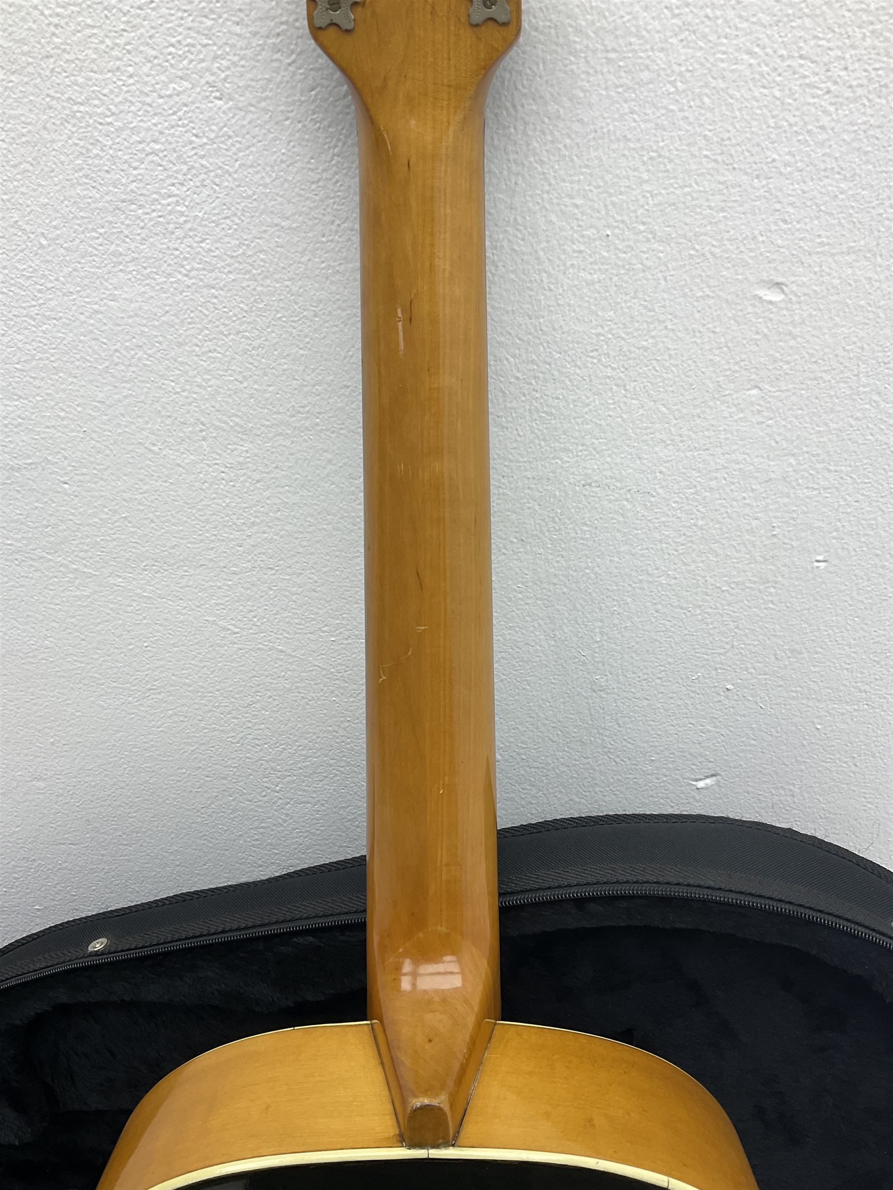 1950s acoustic guitar with f-holes and pickguard L105cm; black fur lined hard carrying case