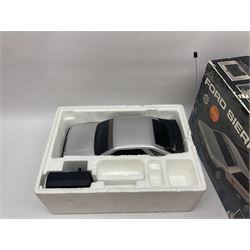 Quantity of model cars to include Atcomi radio control Ford Sierra XR4i, Maisto 1:18 scale Volkswagen Export Sedan, Corgi Tom & Jerry cars, Lledo, Dinky, Matchbox etc, boxed and loose 