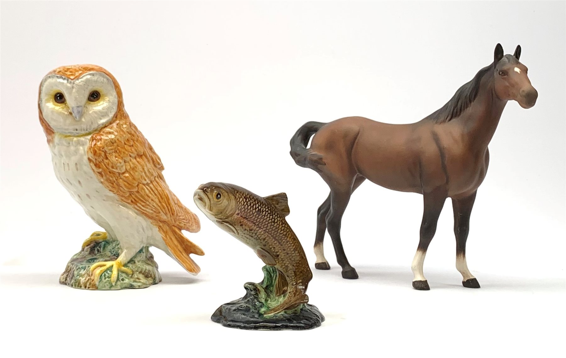 Three Beswick figures. comprising Barn Owl 1046, Trout 1390, and horse with matt brown glaze, Owl and Trout with impressed marks beneath, Horse with printed mark beneath. 