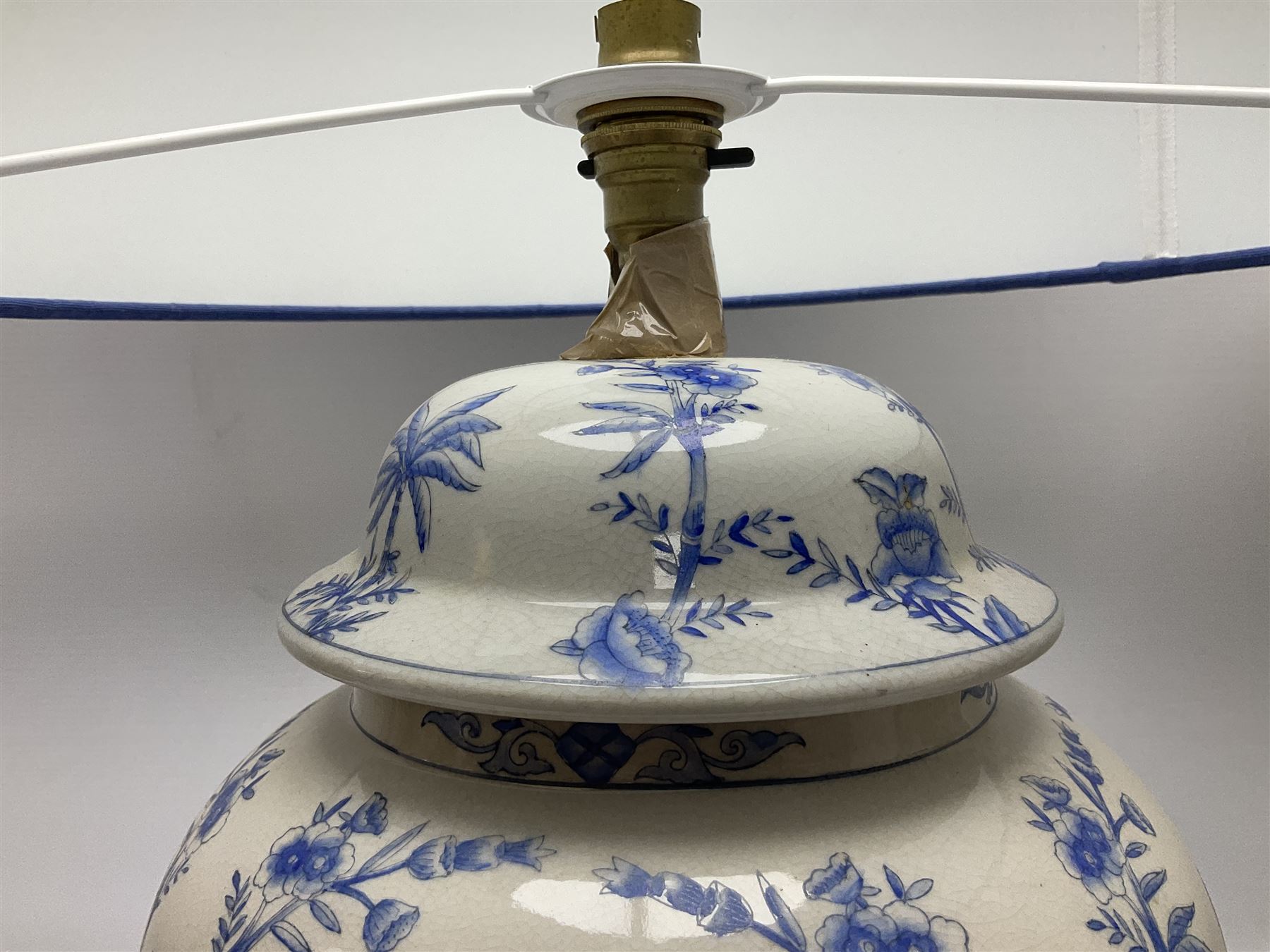 Modern pierced oriental white ceramic vase shaped table lamp, together with a blue and white baluster shaped example decorated with figures upon elephants, both with shades, tallest H83cm incl shade