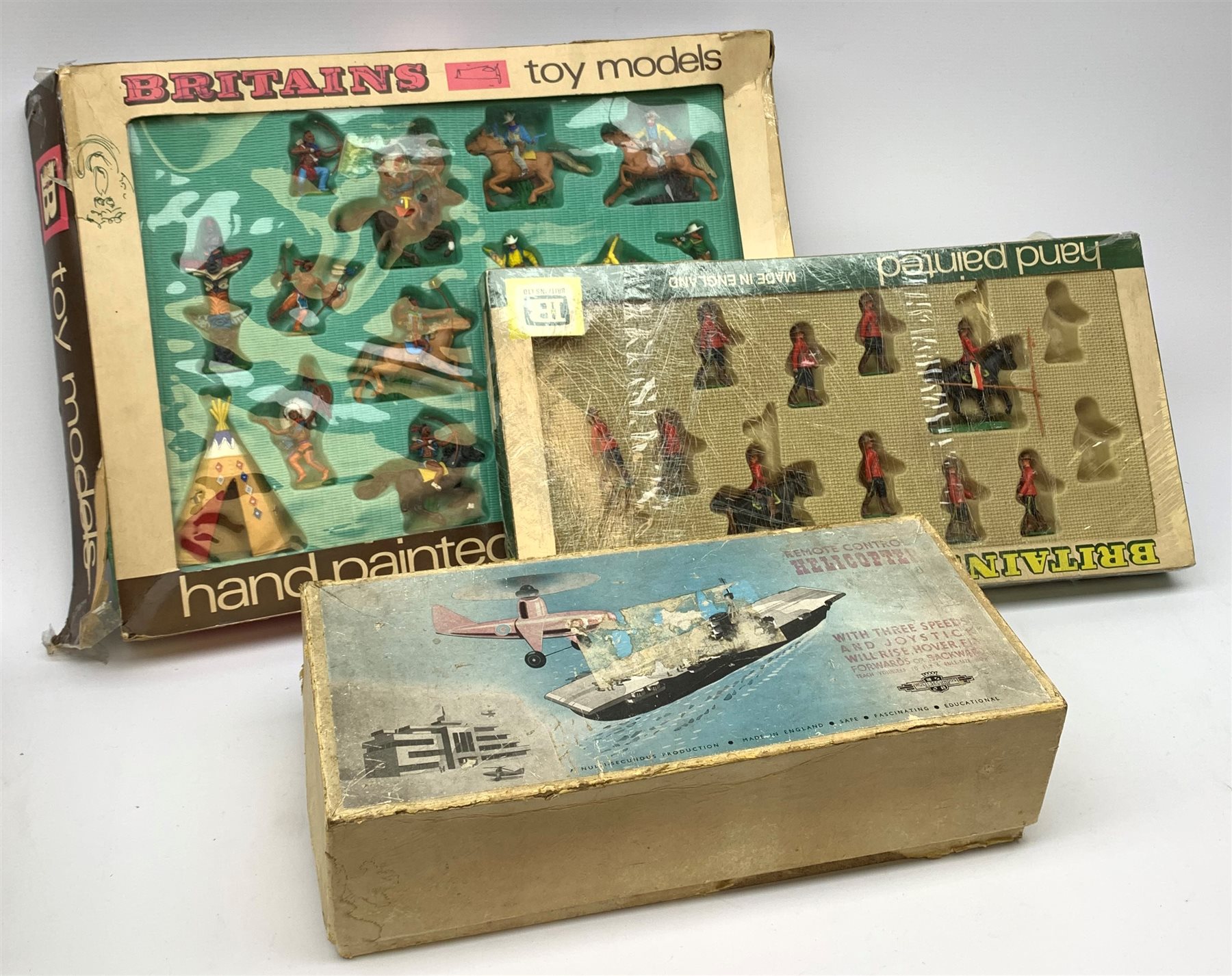 Britains Deetail Cowboys and Indians set No.7630, boxed; Britains part set of Royal Canadian Mounted Police No.7695, boxed; and Nulli Secundus Remote Control Helicopter, boxed (3)