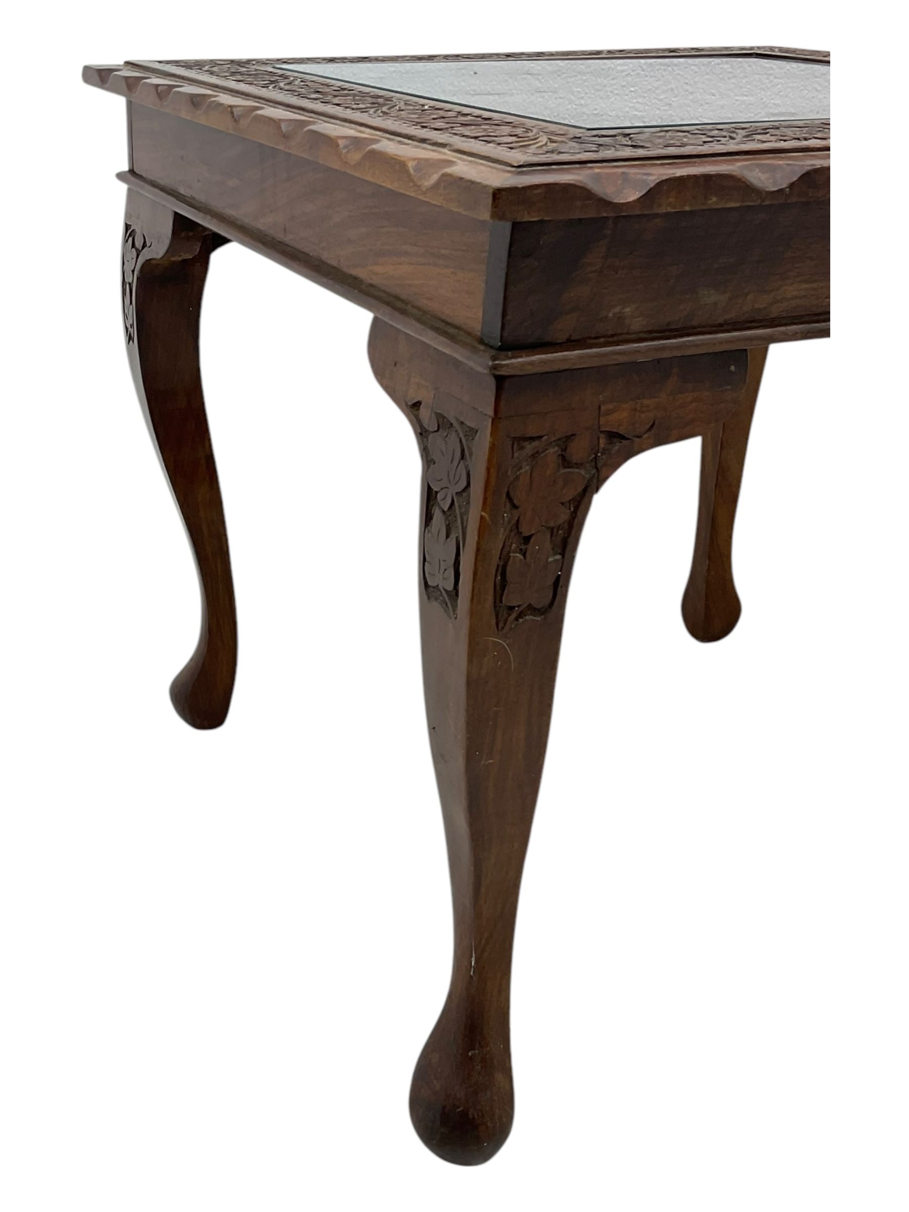 Pair of Pakistan carved hardwood brass inlaid lamp tables, square form, cabriole legs, inset glass tops