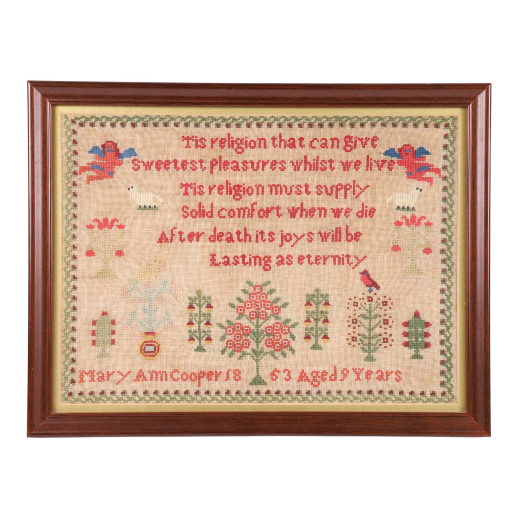 Victorian needlework sampler worked by Mary Ann Cooper Aged 9 Years 1863, containing verse 'Tis religion that can give the sweetest pleasure ...' together with motifs to include animals, trees and cherubs, H35cm