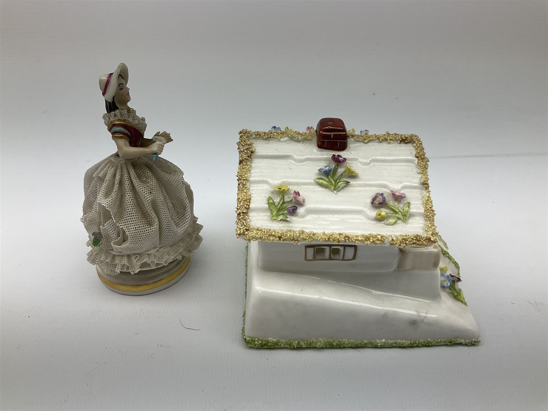 Group of figures, comprising six Royal Doulton examples, Daydreams HN1731, Silks and Ribbons HN2017, Tom Sawyer HN2926, Marie HN1370, Bo-Peep HN1811, and Tinkle Bell HN1677, together with a Dresden type 'lace' example, and a Coalport 'Swiss Cottage', (8)